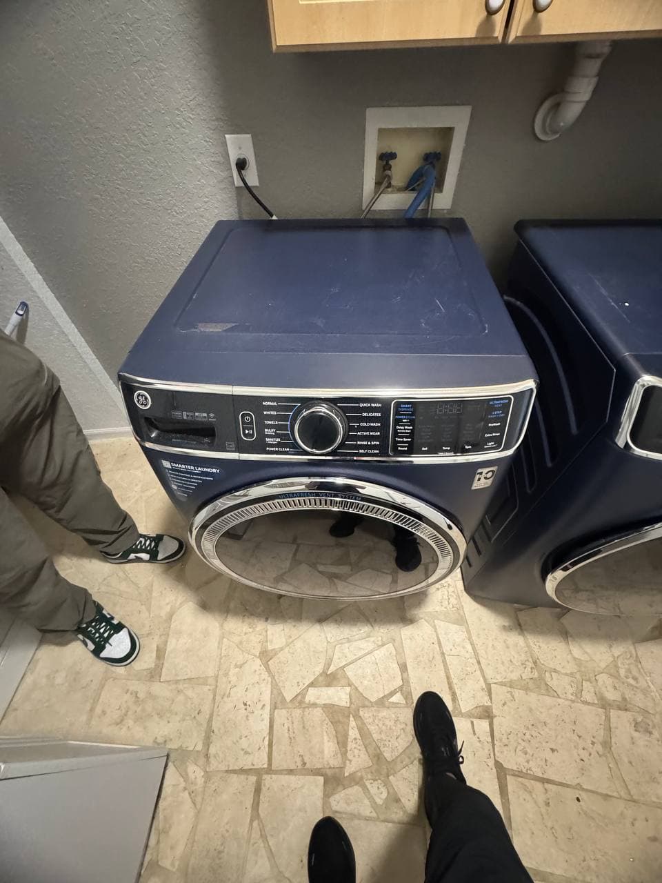 Washer Repair by Same Day Appliance Fix — Palm Beach County FL | Call $<span className="tabular">{BUSINESS.phone}</span> GE front-load washer repair in progress — technician diagnosing spin cycle issue in laundry room